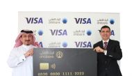 Mohamed Al Namla (left), Deputy CEO - Business Support, Services and Human Resources of Ahlibank, during the launch ceremony.