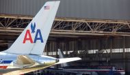 FILE PHOTO: An American Airlines airliner sits near a hanger at Dallas/Fort Worth International Airport, Texas April 4, 2012. REUTERS/Tim Sharp/File Photo