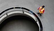 In this file photo an MTA worker walks through a nearly empty Fulton Street subway station complex on July 7, 2020 in Lower Manhattan, New York City. American families were slightly less pessimistic about their finances and jobs in June, but remained conc