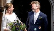Danish Prime Minister Mette Frederiksen and her husband Bo Tengberg smile after getting married in Magleby Church, in Magleby, Denmark July 15, 2020. Ritzau Scanpix/via REUTERS