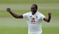 England's Jofra Archer celebrates taking the wicket of West Indies' Shamarh Brooks, as play resumes behind closed doors following the outbreak of the coronavirus disease (COVID-19) Adrian Dennis/Pool via REUTERS/File Photo
