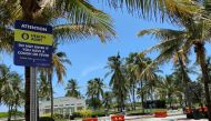 A sign warning about the spread of coronavirus disease (COVID-19) is seen in Miami Beach, Florida, U.S. July 14, 2020. Picture taken July 14, 2020. REUTERS/Zachary Fagenson
