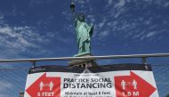 The Statue of Liberty is pictured as New York enters Phase 4 of reopening following the outbreak of the coronavirus disease (COVID-19) in New York City, New York, U.S., July 20, 2020. REUTERS/Carlo Allegri
