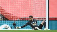 FILE PHOTO: Wembley Stadium, London, Britain - July 19, 2020 Chelsea's Olivier Giroud (not pictured) scores their first goal past Manchester United's David de Gea. Pool via REUTERS/Andy Rain/File Photo