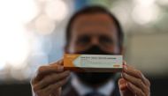 Brazil's Sao Paulo state governor, Joao Doria holds a box of the China's Sinovac coronavirus potential vaccine for trials during a news conference at Hospital das Clinicas, in Sao Paulo, Brazil July 21, 2020. REUTERS/Amanda Perobelli