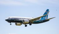 In this file photo taken on June 29, 2020 a Boeing 737 MAX jet comes in for a landing following a Federal Aviation Administration (FAA) test flight at Boeing Field in Seattle, Washington. The grounded Boeing 737 MAX moved another step closer towards flyin