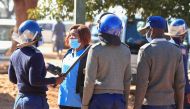 FILE PHOTO: Police arrest a health worker during a protest against economic hardship and poor working conditions during the coronavirus disease (COVID-19) outbreak in Harare, Zimbabwe,July 6, 2020. REUTERS/Philimon Bulawayo/File Photo
