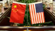 (FILES) In this file photo taken on June 30, 2017, flags of the US and China are placed ahead of a meeting at the Ministry of Agriculture in Beijing. AFP / POOL / JASON LEE