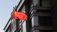 China’s national flag is seen waving at the China Consulate General in Houston, Texas, U.S., July 22, 2020. REUTERS/Adrees Latif

