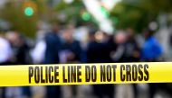 (FILES) In this file photo taken on October 12, 2019 Police tape secures a crime scene outside a club after a shooting in Brooklyn . \/ AFP / Johannes EISELE