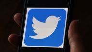 In this file photo illustration, a Twitter logo is displayed on a mobile phone on May 27, 2020, in Arlington, Virginia. Twitter said on July 23, 2020, user growth soared in the past quarter even as ad revenues took a hit amid civil unrest in the US. The s
