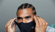 Former boxing heavyweight world champion David Haye poses for a photograph following the launch of his premium range of high-tech face masks, ahead of the British Government's law on wearing face masks in shops coming into effect on Friday 24th July, amid