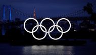 FILE PHOTO: The giant Olympic rings are pictured two days before the start of the one-year countdown to the Tokyo Olympics that have been postponed to 2021 due to the coronavirus disease (COVID-19) outbreak, at the waterfront area at Odaiba Marine Park in