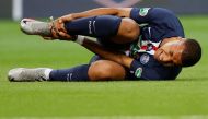 Paris St Germain's Kylian Mbappe reacts after sustaining an injury, following the outbreak of the coronavirus disease (COVID-19) REUTERS/Christian Hartmann