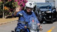 Brazilian President Jair Bolsonaro waves as he takes a ride after he announced he tested negative for COVID-19 more than two weeks after being diagnosed, in Brasilia, on July 25, 2020. (AFP / Sergio LIMA)