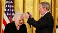 FILE PHOTO: U.S. President George W. Bush presents veteran actress Olivia de Havilland with a National Medal of Arts during a ceremony at the White House in Washington in Washington, U.S. November 17, 2008. REUTERS/Jason Reed/File Photo
