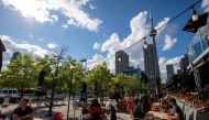 FILE PHOTO: People enjoy drinks and food at Amsterdam Brewhouse's patio, as the provincial phase 2 of reopening from the coronavirus disease (COVID-19) restrictions begins in Toronto, Ontario, Canada June 24, 2020. REUTERS/Carlos Osorio/File Photo