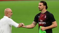 Head Coach of AC Milan, Steano Pioli shakes hands with Zlatan Ibrahimovic of AC Milan during the Serie A match between AC Milan and Atalanta at Stadio Giuseppe Meazza on July 24, 2020 in Milan, Italy. Pier Marco Tacca - Anadolu