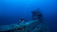 A volunteer diver of the environmental group Ghost Diving swims near the WWII wreck of the HMS Perseus, off the island of Kefalonia, Greece, July 24, 2020. Picture taken July 24, 2020. Giorgos Kolikis/Ghost Diving/Handout