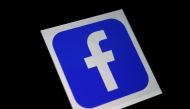 In this file illustration photo taken on March 25, 2020 a Facebook App logo is displayed on a smartphone in Arlington, Virginia. Facebook reported July 30, 2020, that its quarterly profit had nearly doubled and users grew despite a boycott by advertisers.