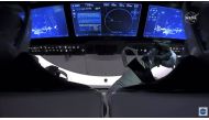 This NASA video frame grab image shows SpaceX’s Crew Dragon spacecraft with NASA astronauts Douglas Hurley and Robert Behnken watching on their screens an infrared view of the International Space Station after undocking from it on August 1, 2020. / AFP / 