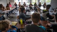 Students attend class at the Christophorusschule school in Rostock, northern Germany, on August 3, 2020, as school resumed after the summer break in the German state of Mecklenburg-Vorpommern (Mecklenburg-Western Pomerania), amid a Coronavirus Covid-19 pa