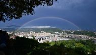 A rainbow is seen over the new San Giorgio bridge on the inauguration day on August 3 , 2020 in Genoa, the new high-tech structure will have four maintenance robots running along its length to spot weathering or erosion, as well as a special dehumidificat