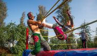 Wrestlers perform during the Chinampalucha event organized by Mexican wrestlers in the chinampas of Xochimilco in Mexico City, on August 1, 2020, as rings remain closed due to the COVID-19 coronavirus pandemic. / AFP / CLAUDIO CRUZ
