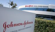 (FILES) In this file photo the Johnson & Johnson logo is seen above an entrance to a building at their campus in Irvine, California on August 28, 2019. 
/ AFP / Mark RALSTON