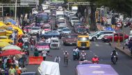 People and cars are pictured on an avenue during the start of gradual reopening of commercial activities, as the coronavirus disease (COVID-19) outbreak continues, in Mexico City, Mexico, July 31, 2020. REUTERS/Edgard Garrido