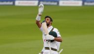 Cricket - First Test - England v Pakistan - Emirates Old Trafford, Manchester, Britain - August 6, 2020 Pakistan's Shan Masood celebrates his century, as play resumes behind closed doors following the outbreak of the coronavirus disease (COVID-19) REUTERS