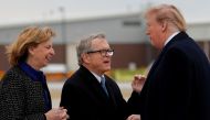 FILE PHOTO: U.S. President Donald Trump shakes hands with Governor of Ohio Mike DeWine as he arrives at Akron-Canton airport in Canton, Ohio, U.S., March 20, 2019. REUTERS/Carlos Barria/File Photo
