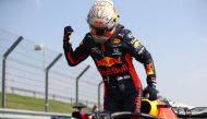 Red Bull's Dutch driver Max Verstappen celebrates after winning the race during the F1 70th Anniversary Grand Prix at Silverstone on August 9, 2020 in Northampton. / AFP / POOL / Bryn Lennon