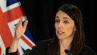 New Zealand's Prime Minister Jacinda Ardern speaks to the media regarding the latest case of COVID-19 coronavirus infections, breaking a 102-day run of no local transmissions, at the parliament in Auckland on August 12, 2020. / AFP / Marty MELVILLE