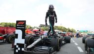 Formula One F1 - Spanish Grand Prix - Circuit de Barcelona-Catalunya, Barcelona, Spain - August 16, 2020 Mercedes' Lewis Hamilton gets out of the car after winning the race Pool via REUTERS/Albert Gea