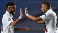 Paris Saint-Germain's Brazilian forward Neymar (L) and Paris Saint-Germain's French forward Kylian Mbappe celebrate after winning at the end of the UEFA Champions League quarter-final football match between Atalanta and Paris Saint-Germain at the Luz Stad