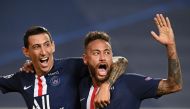 Paris Saint-Germain's Argentine midfielder Angel Di Maria (L) celebrates with Paris Saint-Germain's Brazilian forward Neymar after scoring his team's second goalduring the UEFA Champions League semi-final football match between Leipzig and Paris Saint-Ger