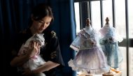 TOPSHOT - This photo taken on August 13, 2020, shows Wu Qiuqiao holding her cat Liu liu at her house in Changsha China's central Hunan province. / AFP / NOEL CELIS