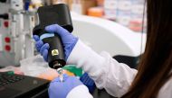 A scientist at RNA medicines company Arcturus Therapeutics research a vaccine for the novel coronavirus (COVID-19) at a laboratory in San Diego, California, U.S., March 17, 2020. REUTERS/Bing Guan/File Photo
