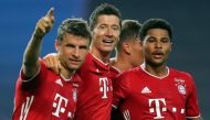 Bayern Munich’s Serge Gnabry (R) celebrates with Thomas Mueller (L) and Robert Lewandowski after scoring a goal during the UEFA Champions League semi-final against Lyon at the Jose Alvalade stadium in Lisbon on August 19, 2020. (AFP)