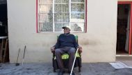 Fredie Blom poses for a portrait while celebrating his 116th birthday at his home in Delft, near Cape Town. (AFP / RODGER BOSCH)