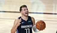 Lake Buena Vista, Florida, USA; Dallas Mavericks' Luka Doncic (77) reacts after being called for a foul against the Los Angeles Clippers during the first half of an NBA basketball first round playoff gameat AdventHealth Arena. Mandatory Credit: Ashley Lan
