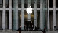 FILE PHOTO: The Apple Inc. logo is seen hanging at the entrance to the Apple store on 5th Avenue in Manhattan, New York, U.S., October 16, 2019. REUTERS/Mike Segar