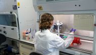 A scientist works during the visit of Britain's William, Duke of Cambridge, to the manufacturing laboratory where a vaccine against the coronavirus disease (COVID-19) has been produced at the Oxford Vaccine Group's facility at the Churchill Hospital in Ox