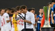 August 21, 2020 Inter Milan coach Antonio Conte with his runners up medal as he walks past the trophy after the match, as play resumes behind closed doors following the outbreak of the coronavirus disease (COVID-19) Martin Meissner/Pool via REUTERS/File P