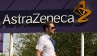 A man walks past a sign at an AstraZeneca site in Macclesfield, central England May 19, 2014. REUTERS/Phil Noble/File Photo