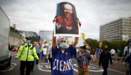 NHS staff member holds an image depicting Britain's?Secretary?of State for?Health Matt Hancock during a protest asking for a pay rise, amid the spread of the coronavirus disease (COVID-19), in London, Britain August 26, 2020. REUTERS/Henry Nicholls NO RES