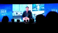 Tesla Inc Chief Executive Officer Elon Musk is seen on a screen during a video message at the opening ceremony of the World Artificial Intelligence Conference (WAIC) in Shanghai, China July 9, 2020. REUTERS/Aly Song/File Photo