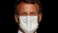 French President Emmanuel Macron, wearing a protective face mask, visits a site of pharmaceutical group Seqens, a global leader on the production of active pharmaceutical ingredients, to mobilize innovation and support the research on the coronavirus dise