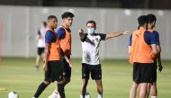 Al Sadd's coach Xavi with players during a training session.